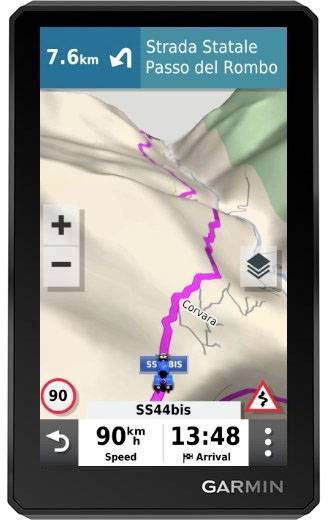 Navigation device shows route '7.6 km on Strada Statale Passo del Rombo'. Current speed 90 km/h, estimated arrival at 1:48 pm.