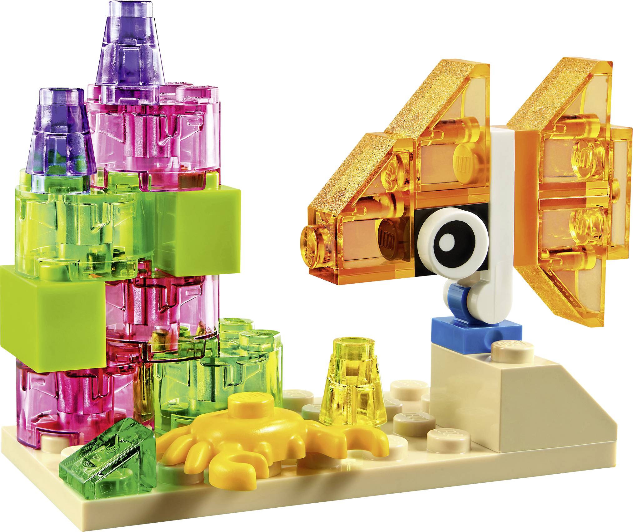 A colourful Lego set depicts a small landscape with a lilac and green structure and a vibrant, butterfly-like object.