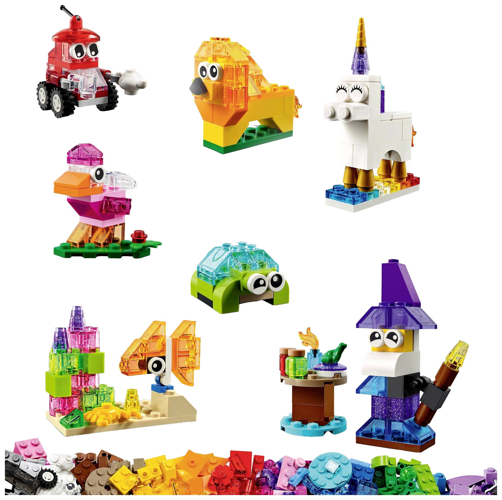 Various colourful LEGO animals and figures, including a unicorn, a lion, a bird, and a witch's bird. LEGO pieces in the foreground.