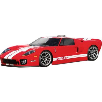 A red sports car with white stripes and grey alloy wheels, photographed from the side. The car has a low, aerodynamic design.