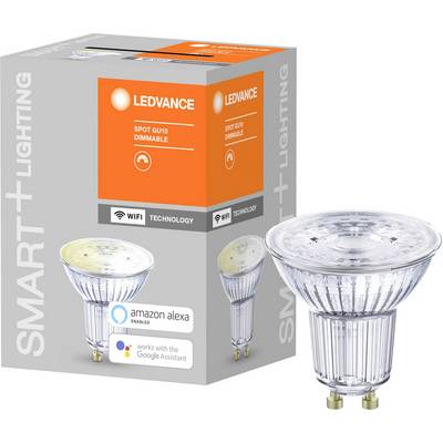 A LED lamp next to its packaging. On the box it reads 'LEDVANCE Spot GU10 dimmable', with symbols for Wi-Fi and voice assistant support.