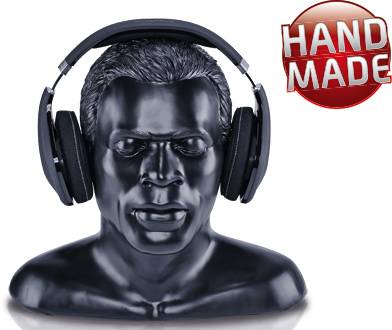 Black bust of a person wearing headphones. A red circle in the top right corner reads 'HAND MADE'.