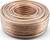 A large, coiled copper wire on a white background. The wire is wound in a spiral and displays a shiny copper colour.