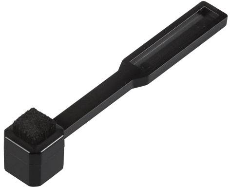 Black vinyl record cleaner with rectangular handle and square brush, primarily used for maintaining record players.