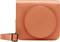 Orange camera case with a round compartment on the front and an adjustable strap on the side.