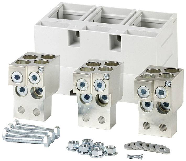 Electrical terminal blocks and screws, lined up next to a white plastic base, ready for assembly or installation.
