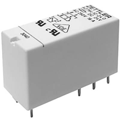 A white, rectangular electronic component with metal pins, presumably a relay, displays technical specifications on its top surface.