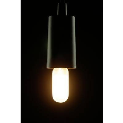 A single hanging light bulb glows in the darkness.