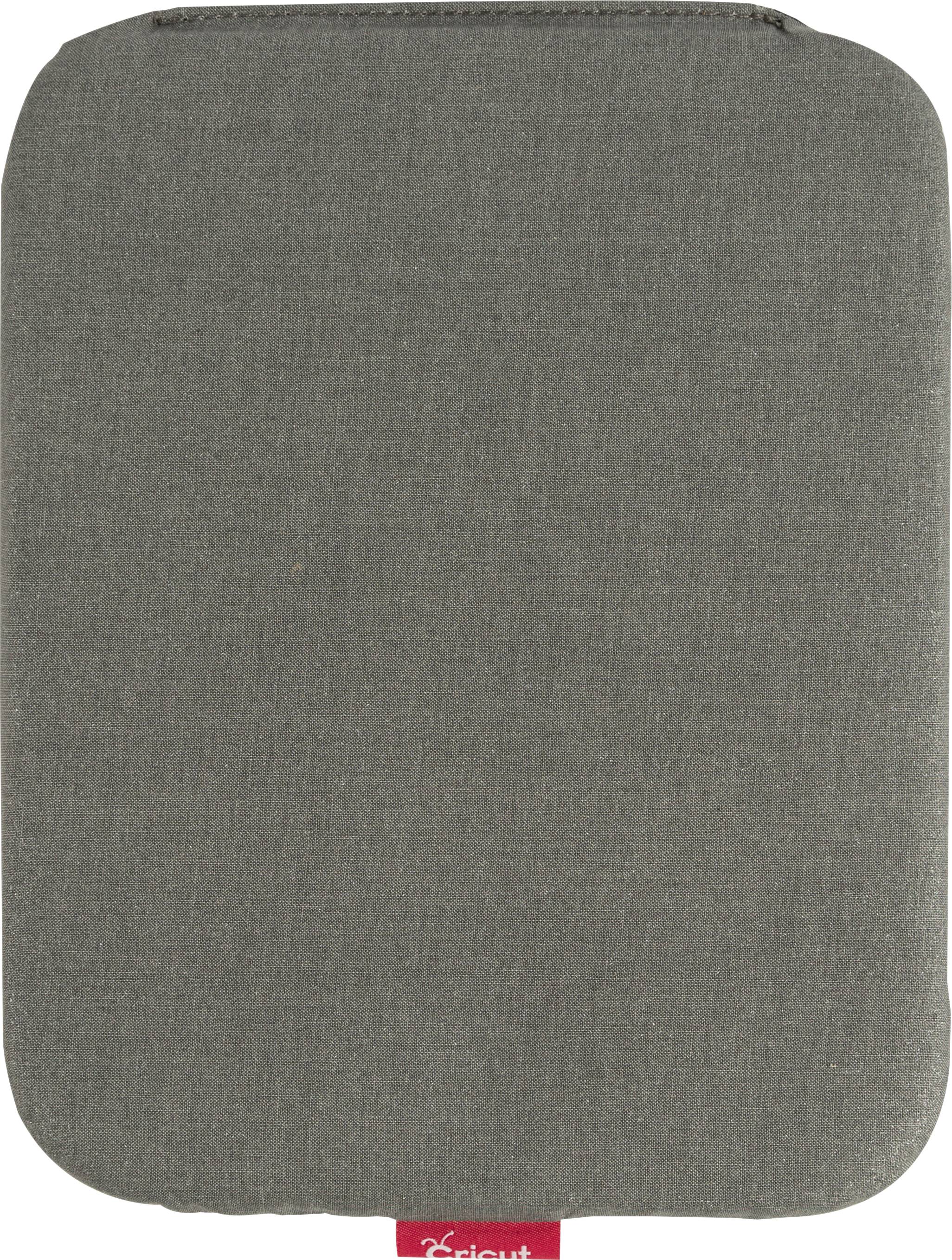 Grey, rectangular cushion with rounded corners and a small red tab on the underside.