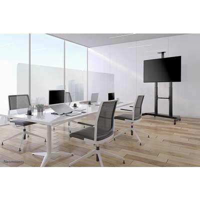 Modern meeting room with large windows, six swivel chairs, a large table with laptops and a presentation screen.