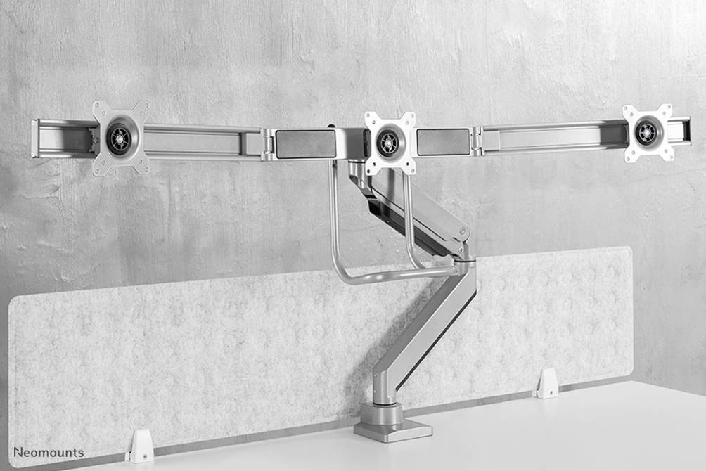 Monitor mount with three articulating arms, mounted on a desk, suitable for securing three monitors.