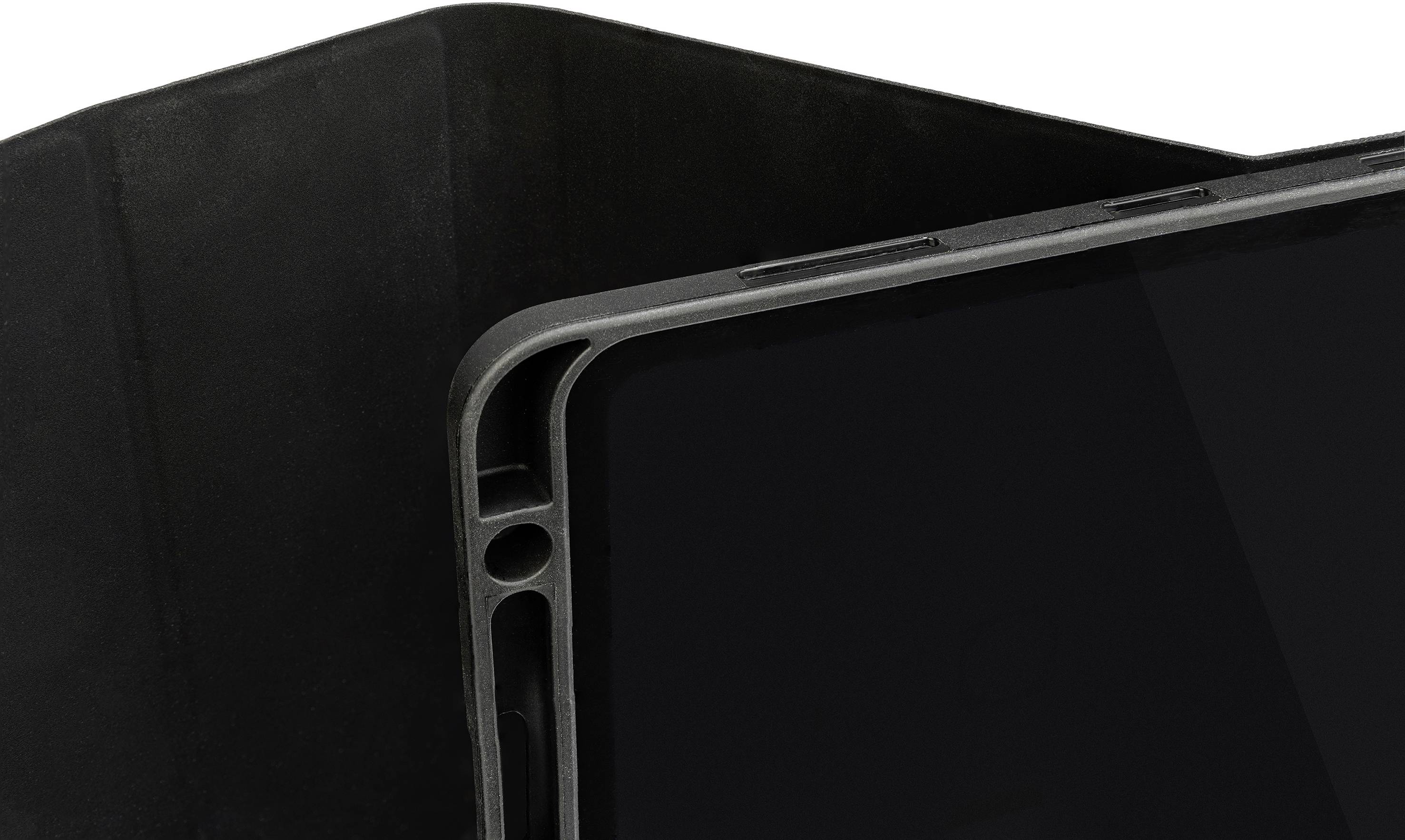 Part of a black tablet cover showing the edge and a small portion of the tablet surface.