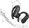 Black wireless earbuds with water resistance, surrounded by splashing water, which illustrates their suitability for sports use.