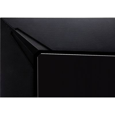 Close-up of a black, modern, angular structure with a fine perforated surface.