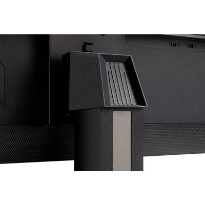 Close-up of a television or monitor stand. It shows the mounting bracket and the textured surface of the base.