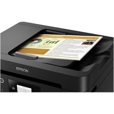 Multifunction printer with a document in the output tray. The document displays diagrams and text related to business trends.