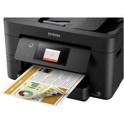 Black multifunction printer prints a coloured document with diagrams and graphics. Brand is visible on the front.