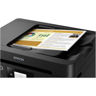 A black Epson printer is scanning a piece of paper with diagrams and text in colour. At the top, 'SOFT SYSTEMS' is written in orange.