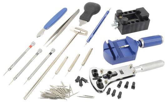 Watchmaker's tool set with screwdrivers, tweezers, watch holder and spring bar tool, for repairing and adjusting watches.