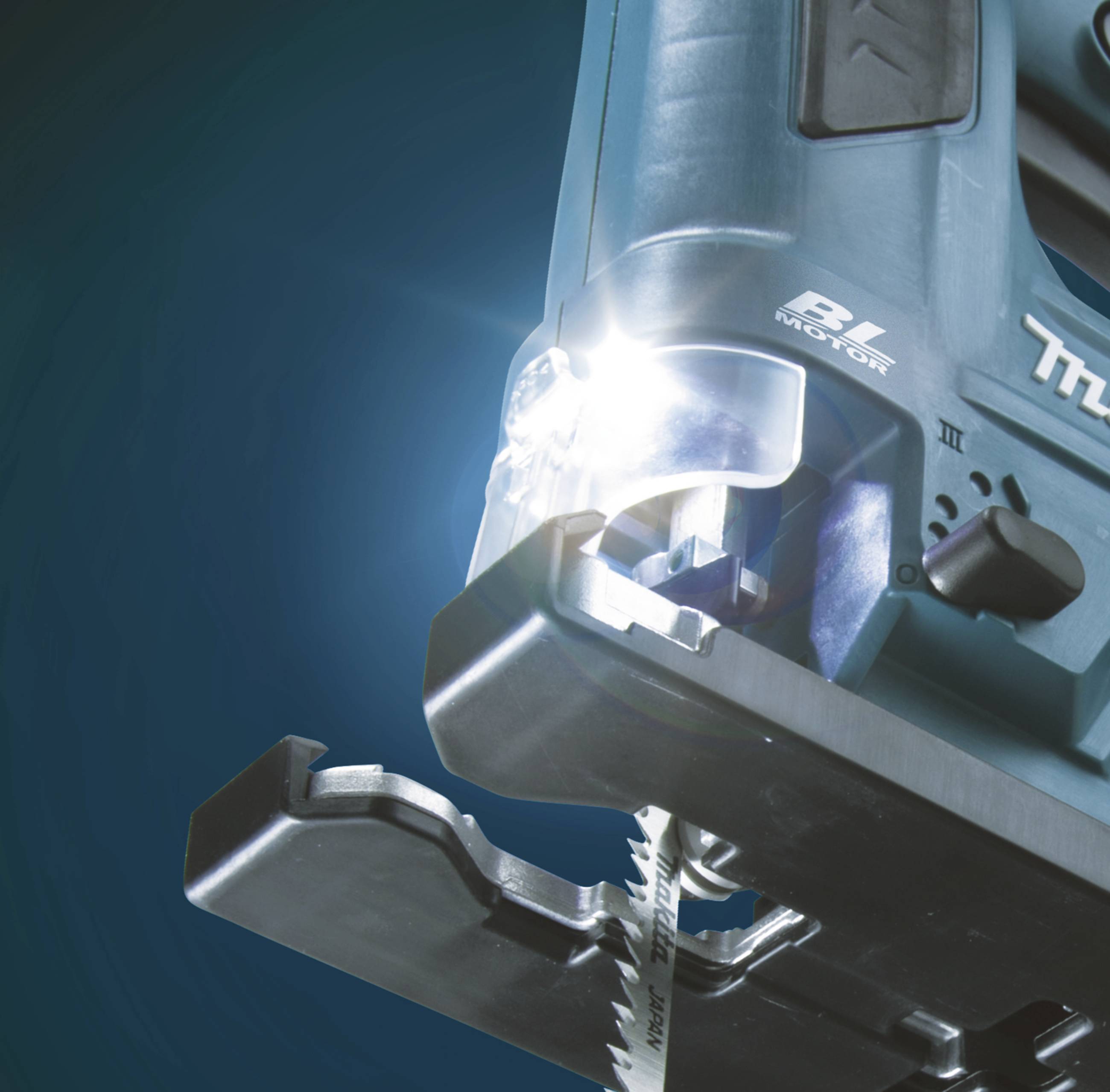 A close-up of an electric jigsaw with LED light. The saw blade is clearly visible and pointing downwards.