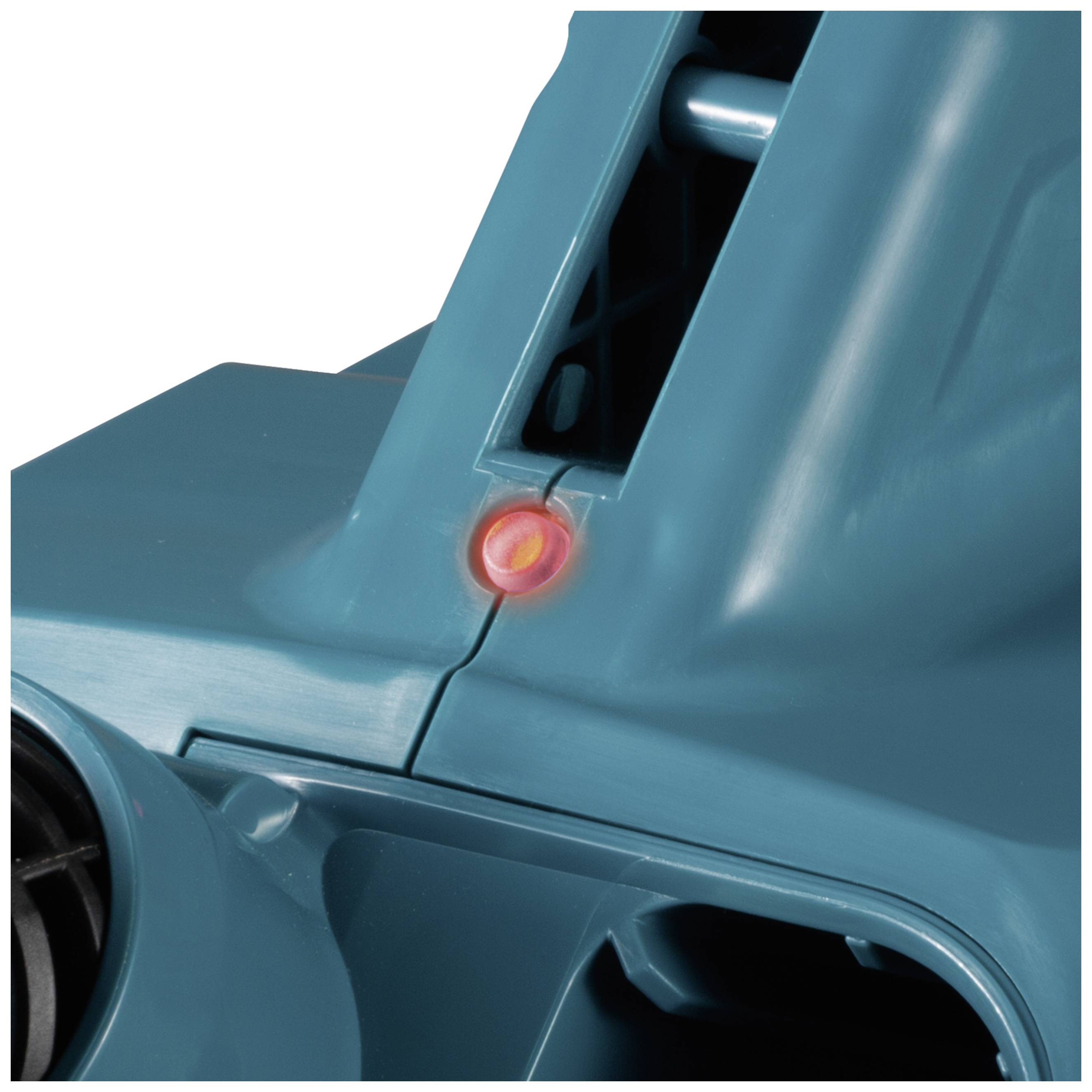 A green plastic device with a glowing red indicator light, signalling operation or status.