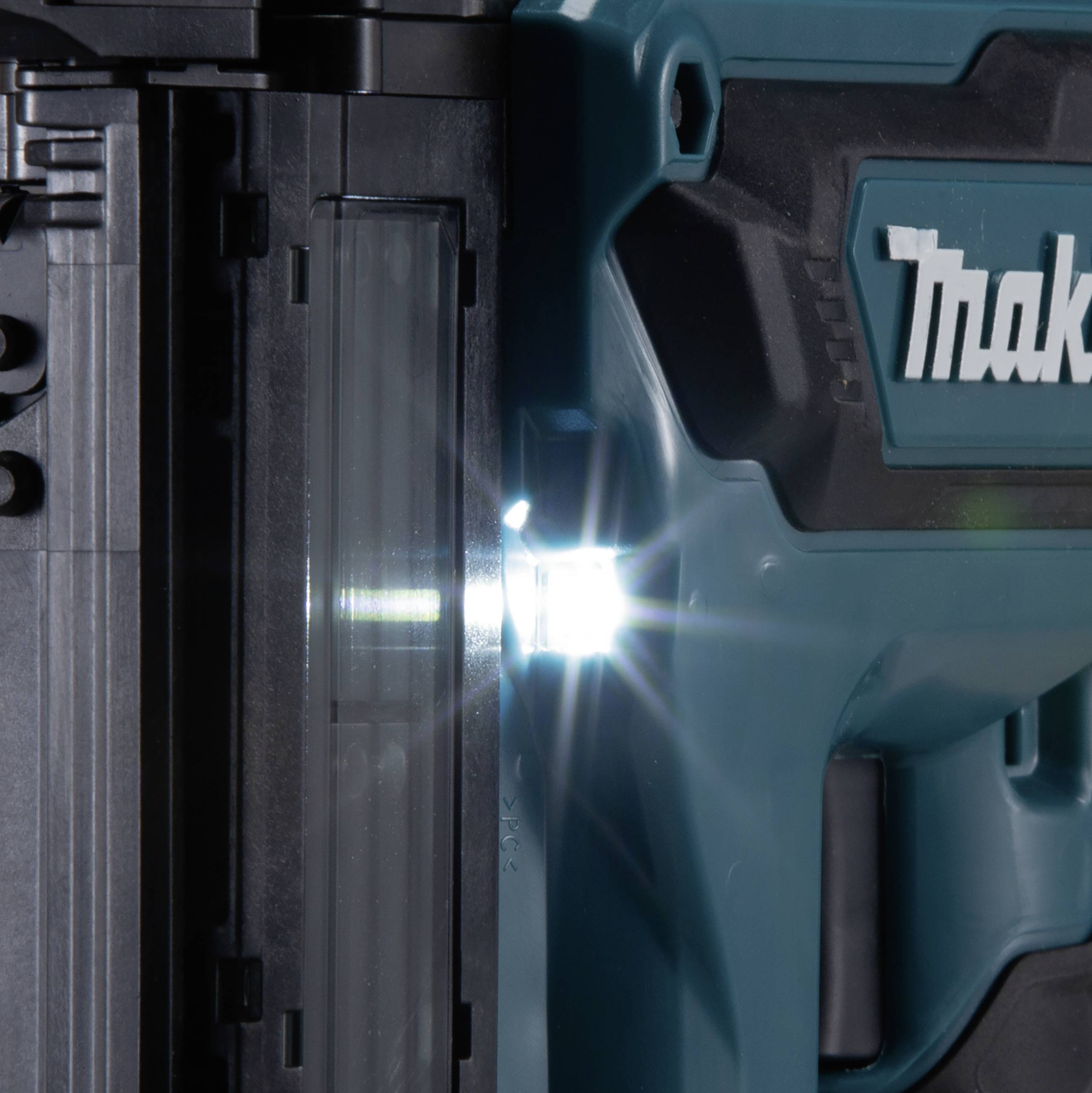 A blue electric tool case with a logo. A bright LED light shines from a tab on the left side of the casing.
