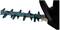 Close-up of a blue hedge trimmer, showcasing the blade design. Suitable for cutting shrubs and small branches.