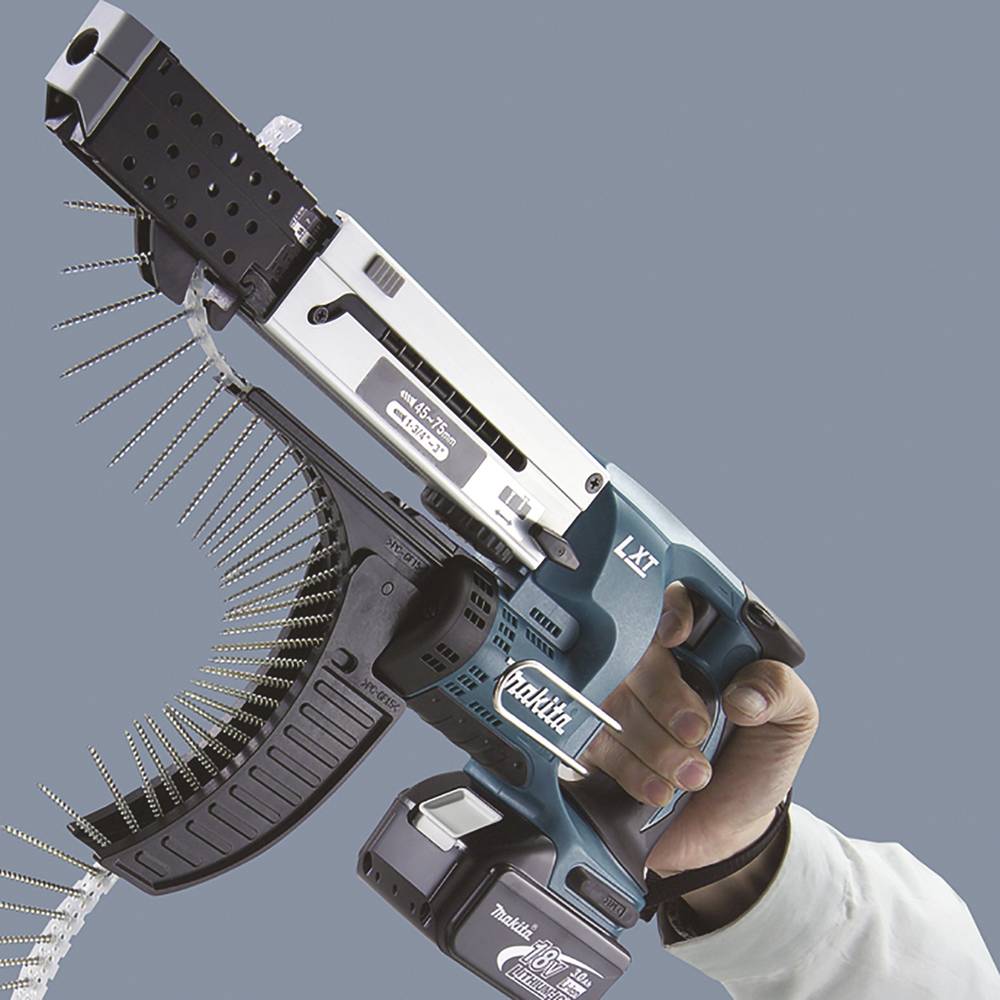 A hand is holding a blue-black electric tool with an attached screw rail, ready for use.