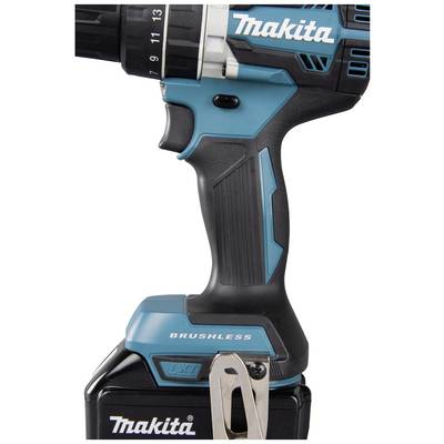 Cordless drill in close-up, side view with 'Makita' logo. Device shows an ergonomic design and has a black and blue handle.