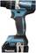 Cordless drill in close-up, side view with 'Makita' logo. Device shows an ergonomic design and has a black and blue handle.