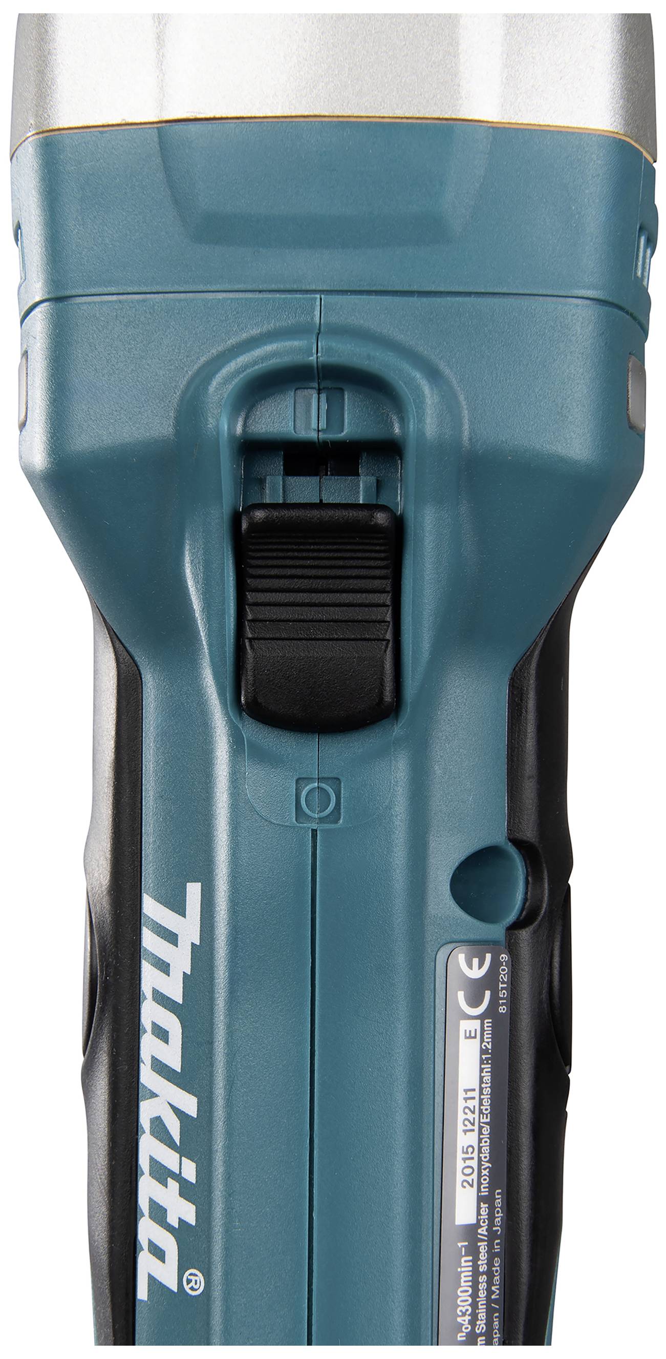 Torch from the front, with a blue casing and black switch in the middle. 'Makita' label on the side.