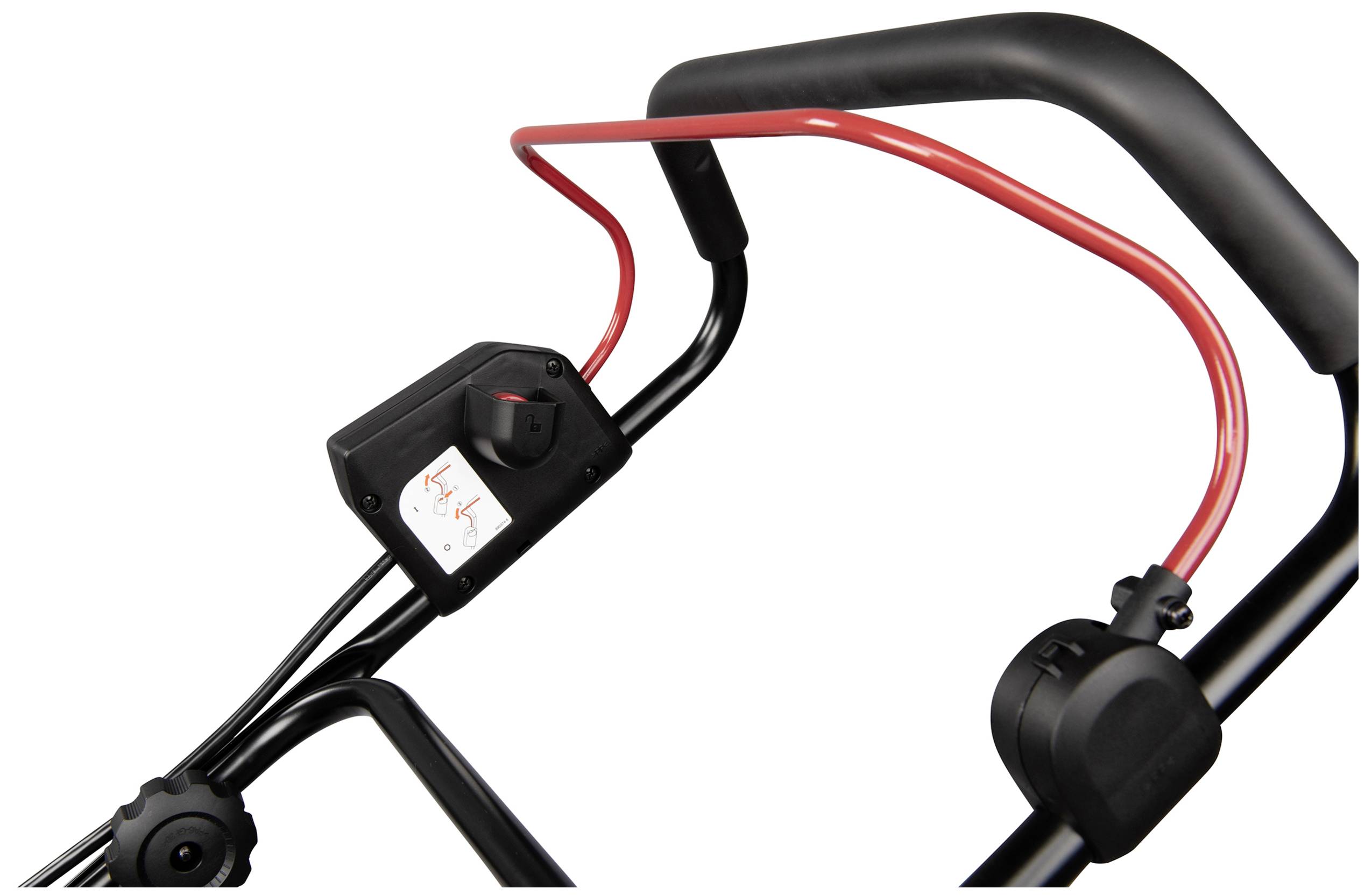 Close-up of a lawnmower handle with a black and red lever, showing the control elements for operating the mower.