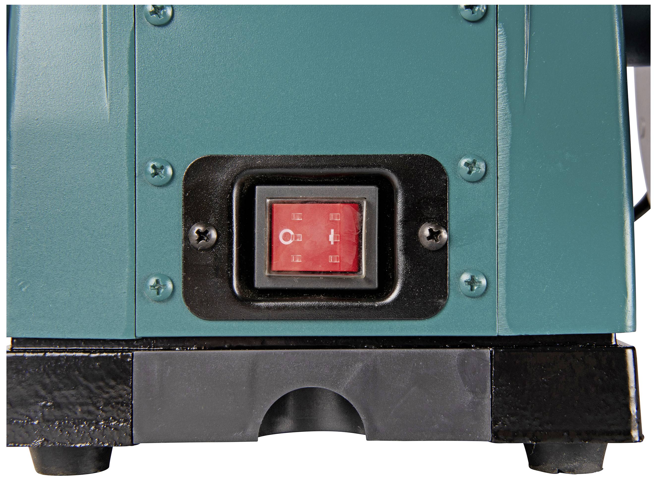 A red on/off switch on a green device. The switch displays the symbols for "On" and "Off".