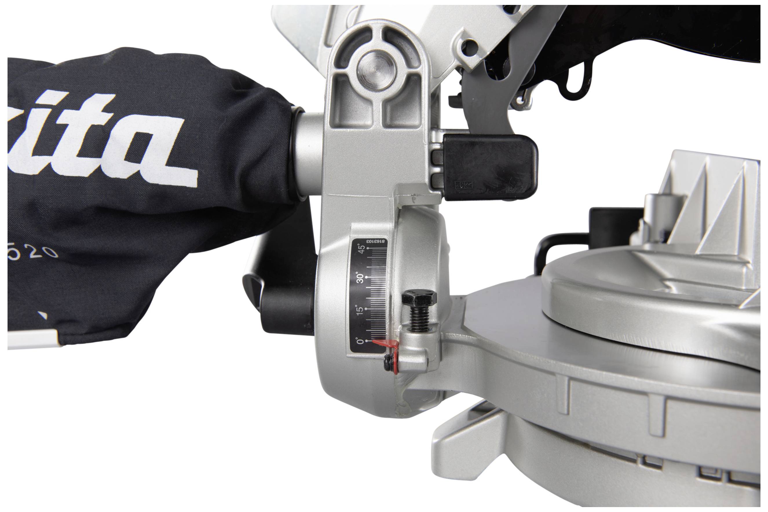 Close-up of a silver mitre saw with angle gauge display and dust bag, in its stored position.