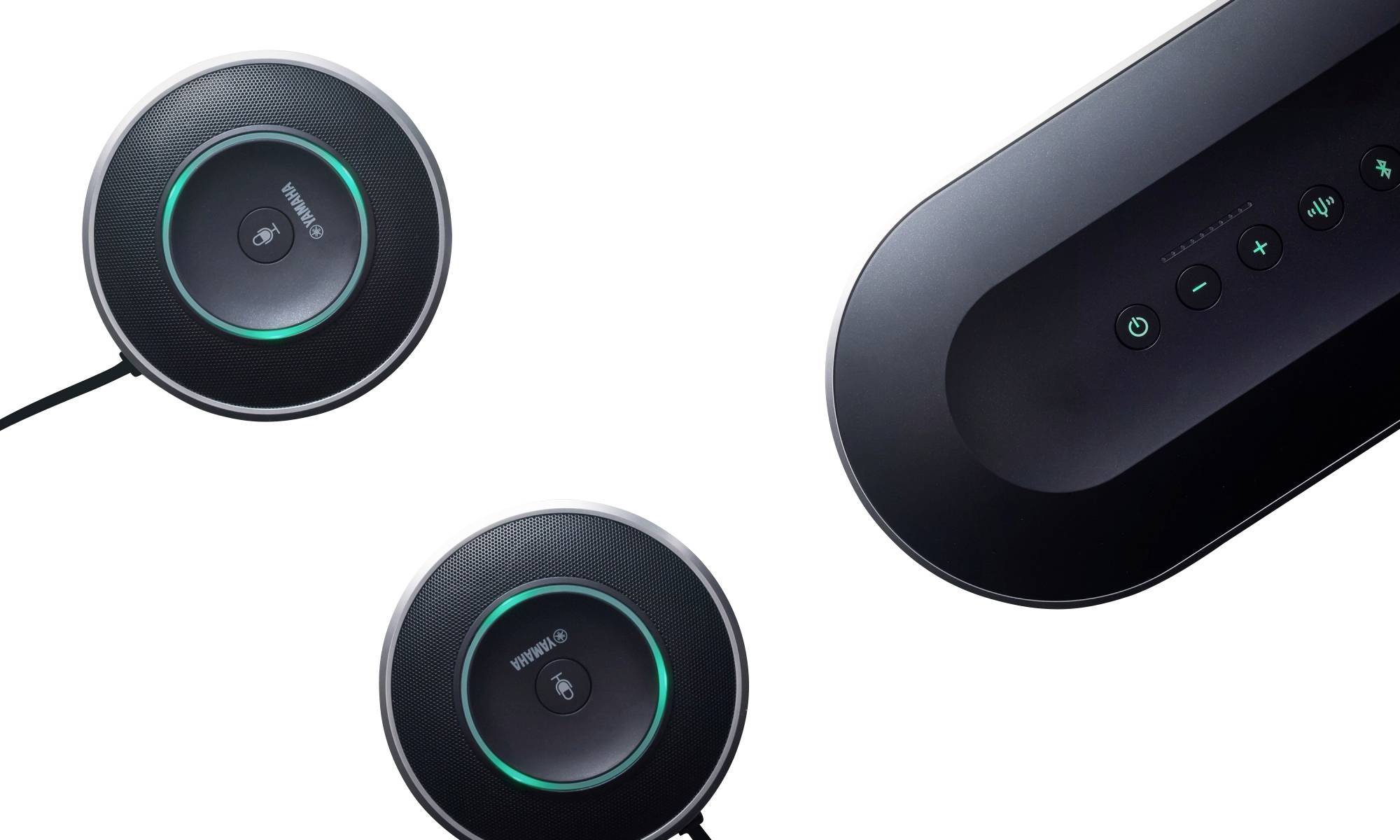 Circular, black speaker systems with green LED illumination, connected via cables, display controls for audio functions.