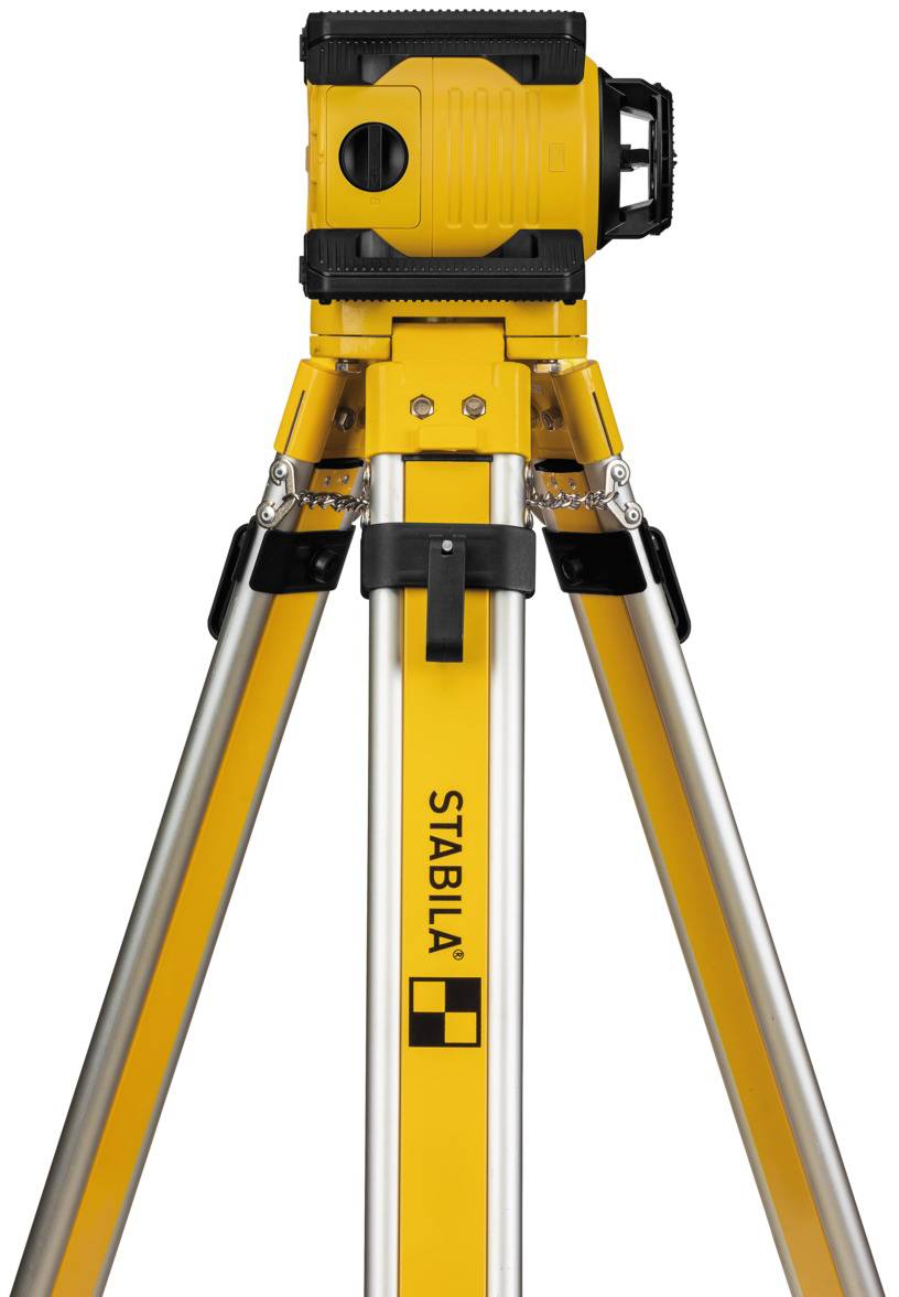 A yellow tripod with a mounted laser device from 'Stabila', used for precise levelling and surveying work in the construction industry.