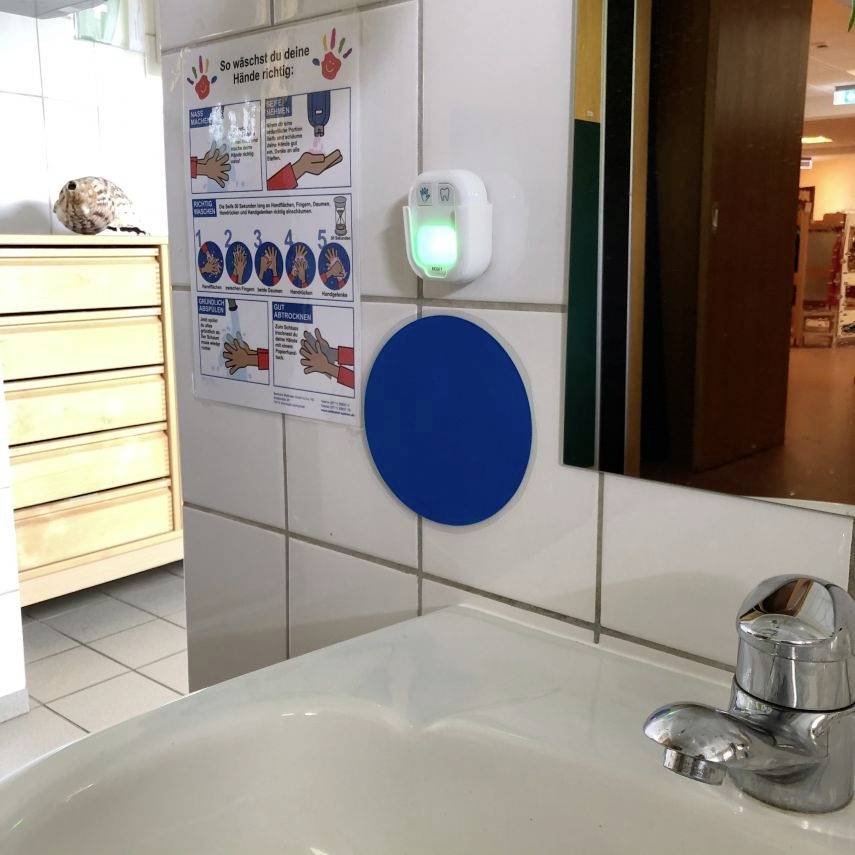 A sink with a sign 'How to Wash Your Hands Correctly', describing steps for proper hand washing.