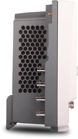 A side view of an electronic device with honeycomb ventilation, four ports on the side, and a stand base for stabilisation.