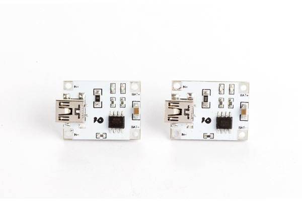 Two identical USB circuits with multiple electronic components on white circuit boards.