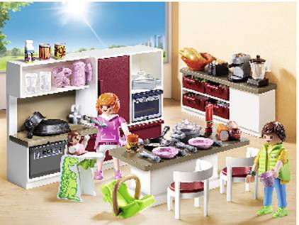 A plastic toy kitchen set with two figures. One figure is holding a saucepan, the other is sitting at the table. Pretend food and crockery are scattered around. A window with sunshine in the background.