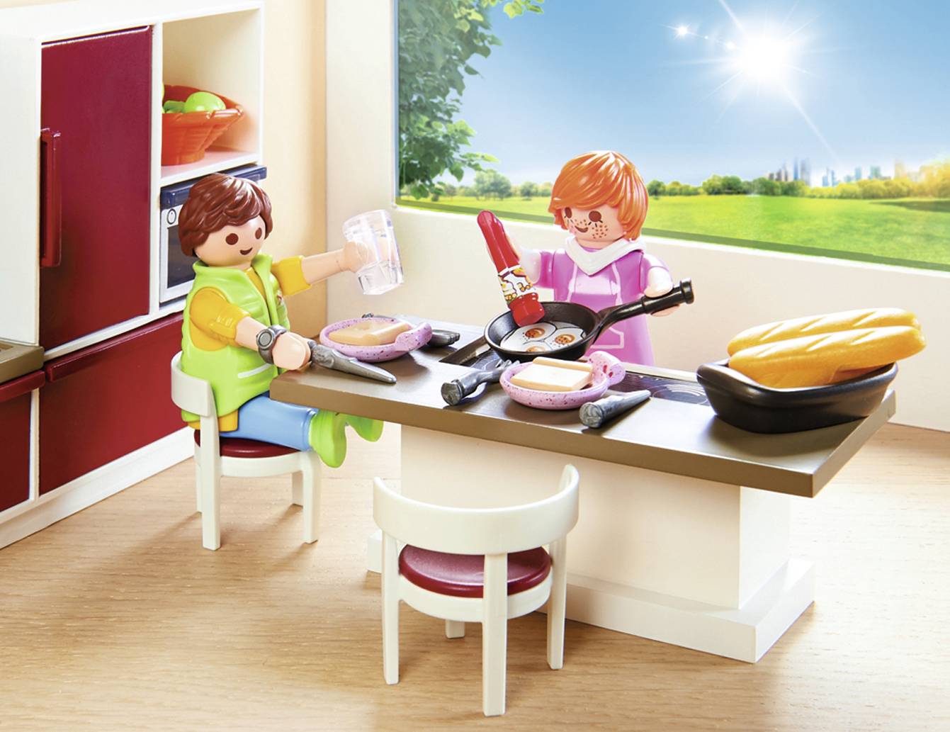 Two Playmobil figures are sitting at a table in a kitchen. One figure is pouring water, the other is cooking. Sunlight streams in.