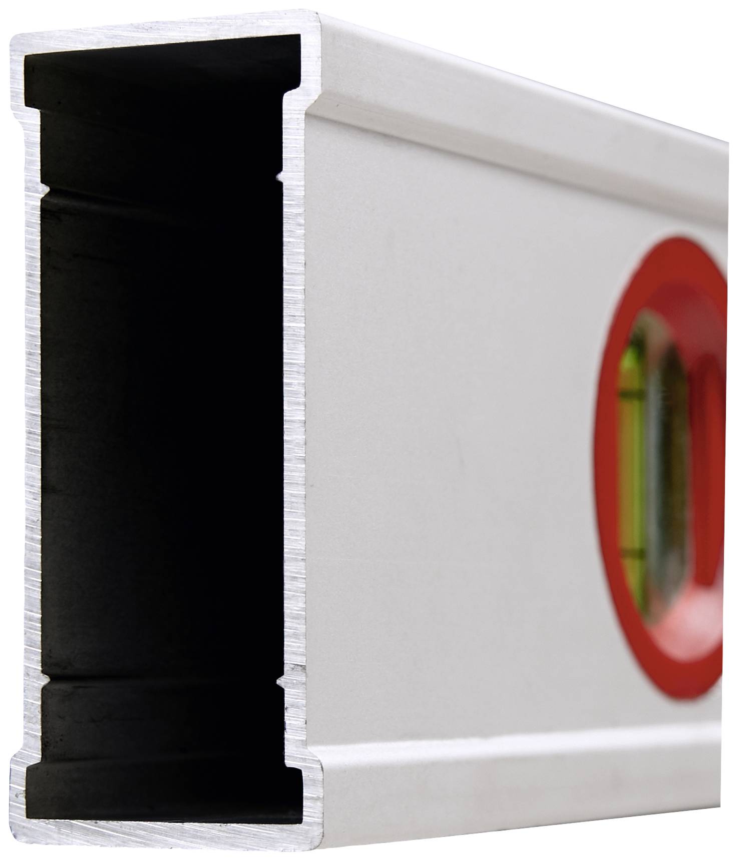 A close-up of a metal spirit level with a visible bubble tube, used to check horizontal alignment.