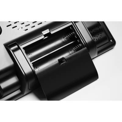 Two AA batteries in an open battery compartment of an electronic device. The compartment shows positive and negative poles.
