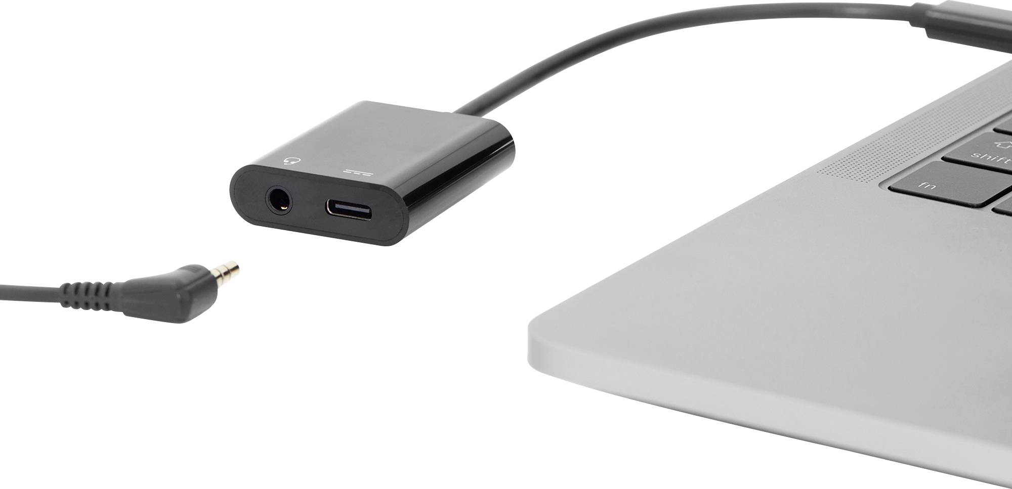 'An adapter connects to a laptop. An audio plug is detached. The adapter has USB-C and audio ports.'