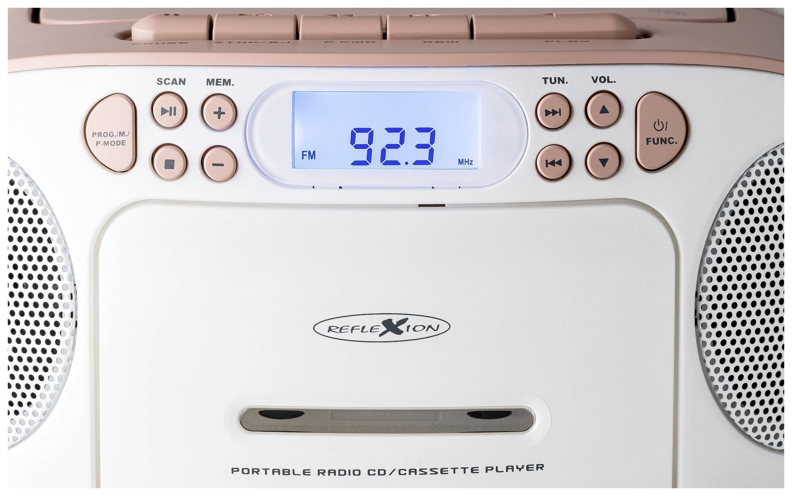 A portable CD/cassette player with a digital display shows 'FM 92.3 MHz'. The control buttons are visible on the top and sides.