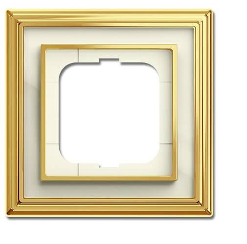 A golden light switch cover without a switch, rectangular with rounded corners, suitable for interiors in a classical style.