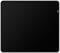 A rectangular, black mouse mat with a smooth surface and slightly rounded corners. A small label is affixed to the top right corner.