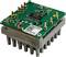 'Electronic circuit with chip and various electronic components mounted on green circuit board.'
