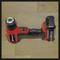 Cordless drill in red and black on a wooden surface. Key feature: High-performance battery.