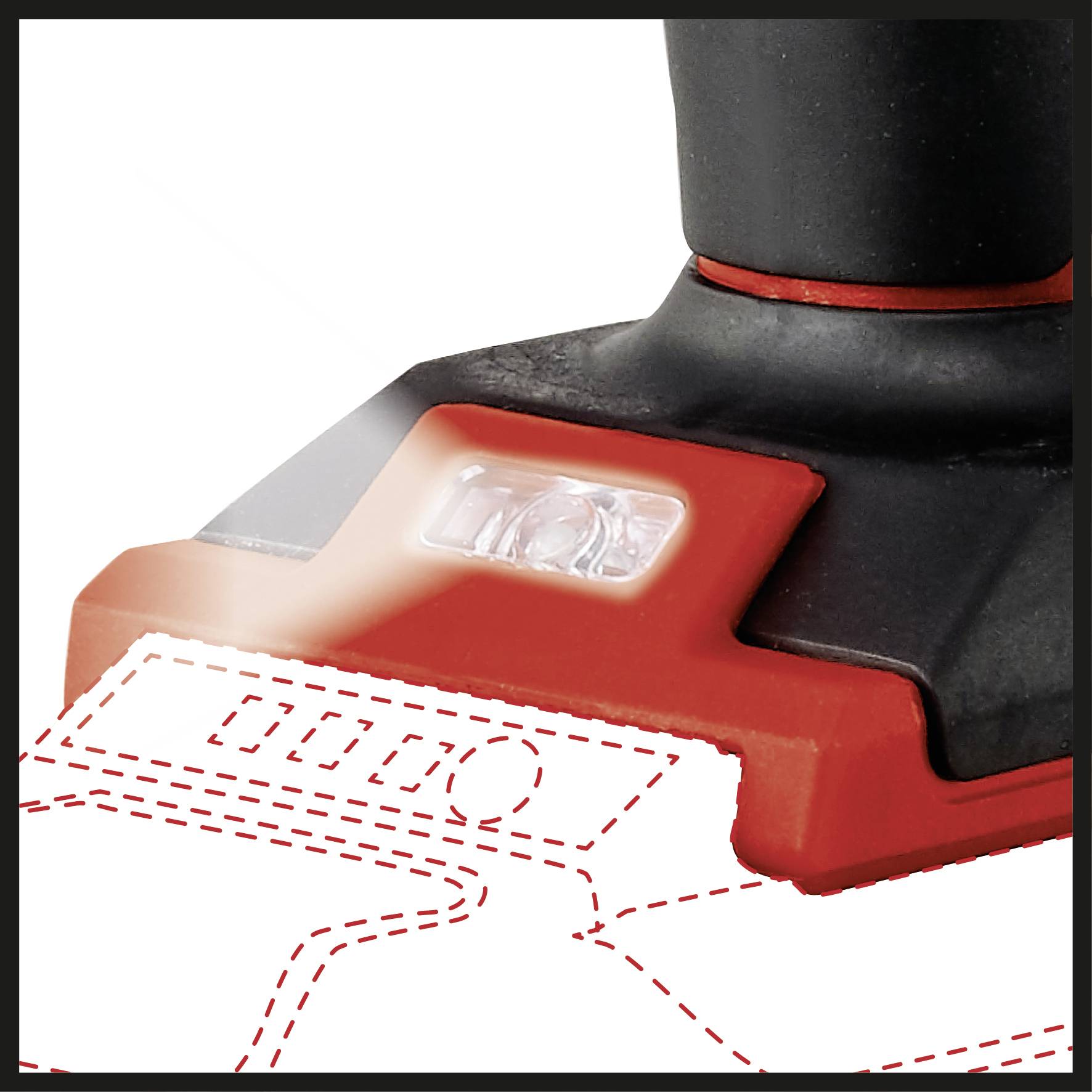 A detail of a red electric power tool with an LED light that illuminates the work surface.